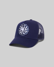 Mens Toby Trucker Cap in navy, featuring a solid front panel and breathable mesh back. A large, centered white embroidered Psycho Bunny skull logo with text adorns the front.