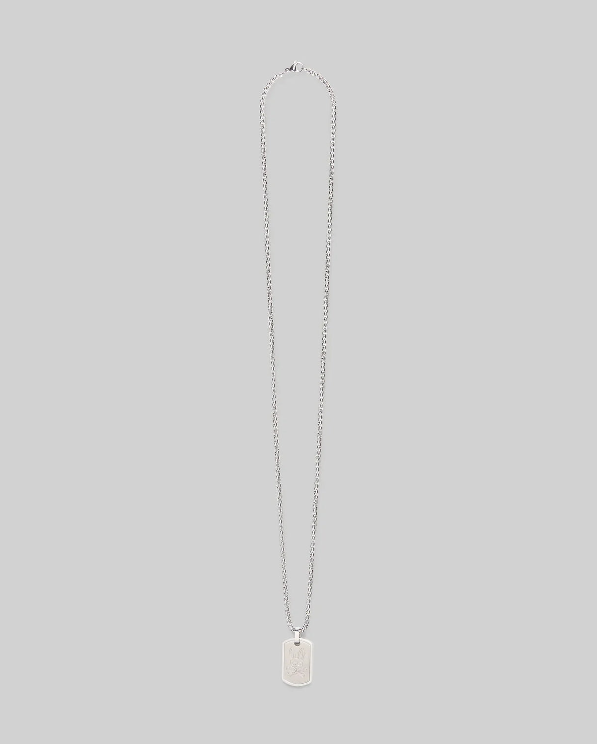 The Psycho Bunny MENS ARMY TAG NECKLACE (MO1700021) features a silver rectangular pendant engraved with a bunny, hanging from a steel cable chain and shown against a plain light gray background.