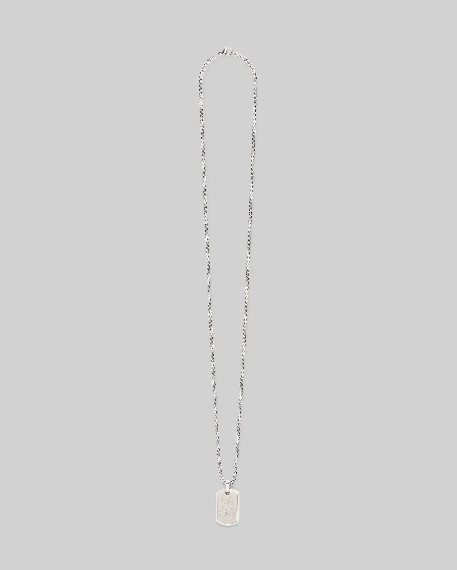 The Psycho Bunny MENS ARMY TAG NECKLACE (MO1700021) features a silver rectangular pendant engraved with a bunny, hanging from a steel cable chain and shown against a plain light gray background.