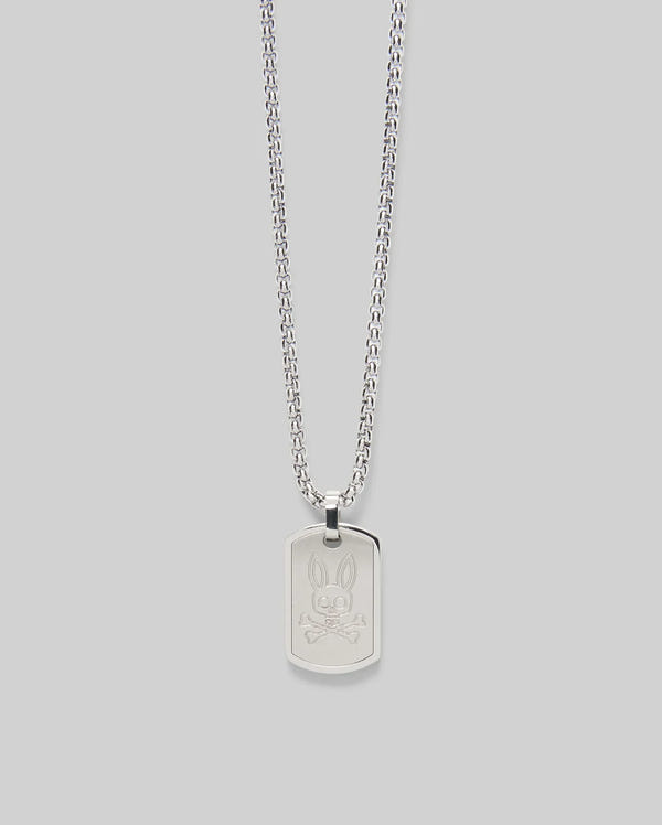 The Psycho Bunny MENS ARMY TAG NECKLACE - MO1700021 features a silver steel cable chain and a rectangular pendant engraved with a cartoon bunny face, shown on a light gray background.