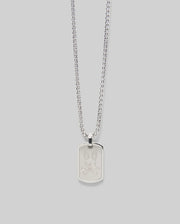 The Psycho Bunny MENS ARMY TAG NECKLACE - MO1700021 features a silver steel cable chain and a rectangular pendant engraved with a cartoon bunny face, shown on a light gray background.
