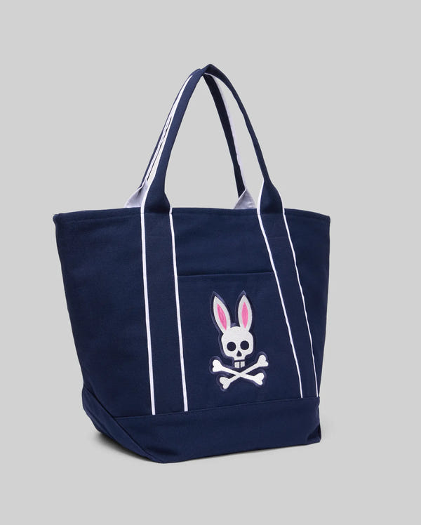 The MENS CANVAS TOTE BAG - MO2400016 by Psycho Bunny is a navy blue, durable tote with white stripes and a front pocket featuring their pink-eared skull and crossbones patch, designed for functionality.