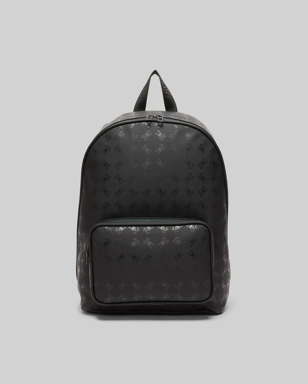 Black Bunny Backpack with an all-over tonal Psycho Bunny skull logo pattern, crafted from smooth material, featuring a front zip pocket and subtle teal zipper detail.
