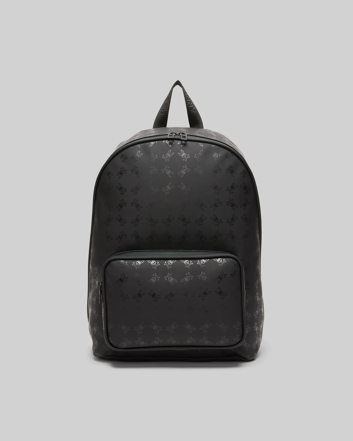 Black Bunny Backpack with an all-over tonal Psycho Bunny skull logo pattern, crafted from smooth material, featuring a front zip pocket and subtle teal zipper detail.