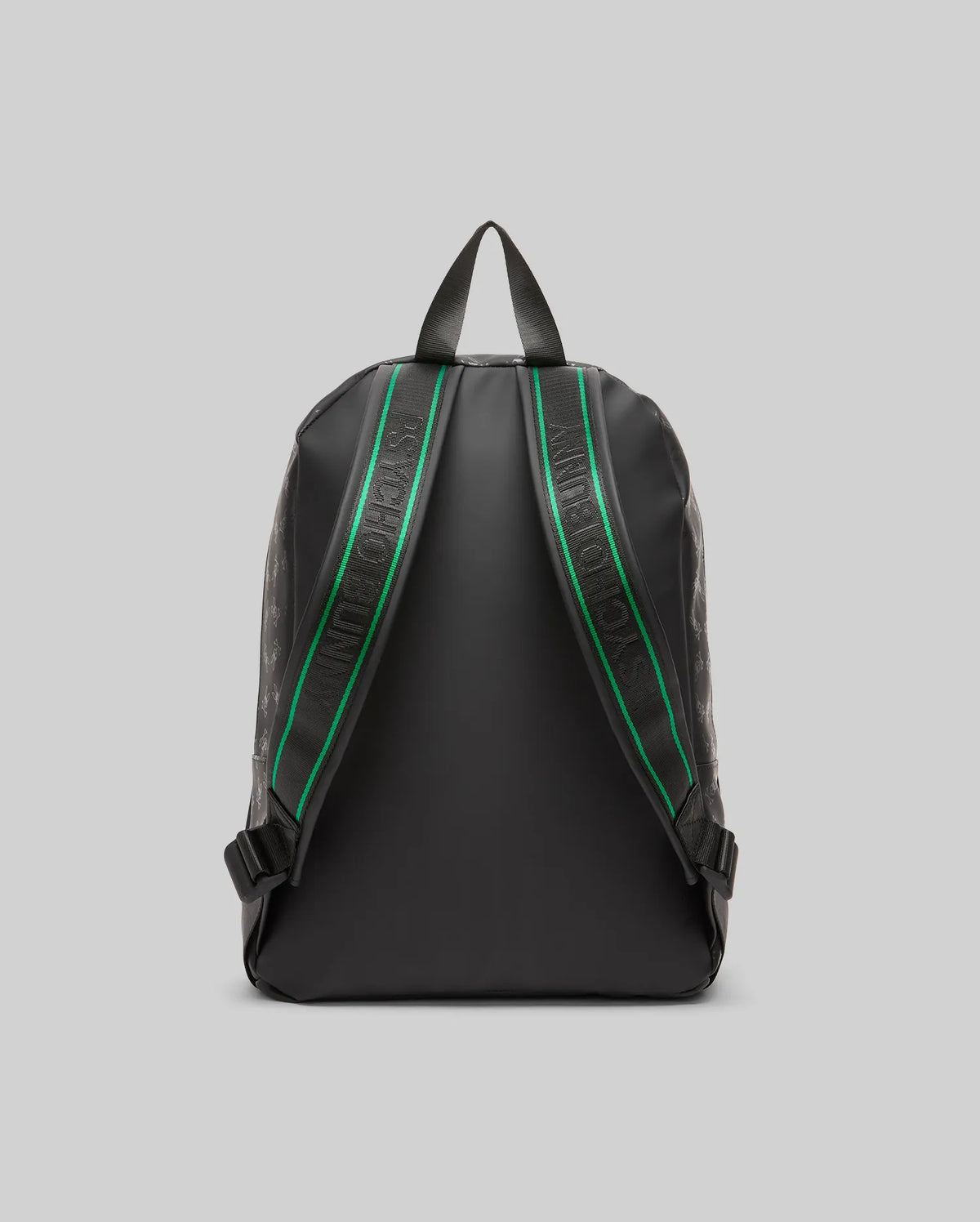 Black Bunny Backpack featuring a subtle tonal all-over Psycho Bunny skull logo pattern, with black shoulder straps accented by a green stripe and white Psycho Bunny text.