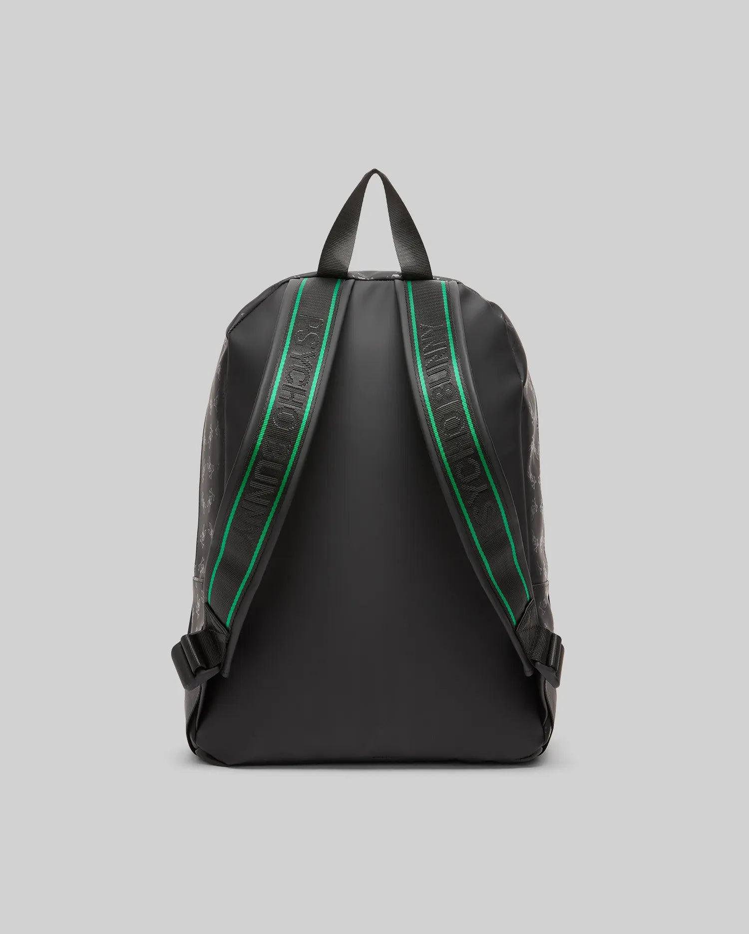 Black Bunny Backpack featuring a subtle tonal all-over Psycho Bunny skull logo pattern, with black shoulder straps accented by a green stripe and white Psycho Bunny text.