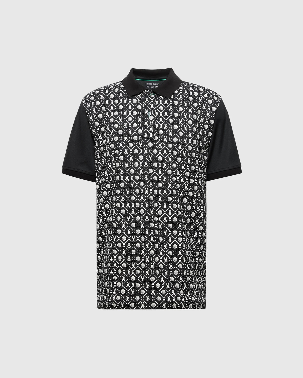 The Psycho Bunny MENS BECKETT PIQUE POLO (MT0100022) is a black short-sleeve Pima cotton shirt with solid black collar and sleeves, featuring a white and gray geometric front pattern on black, shown on a light gray background.