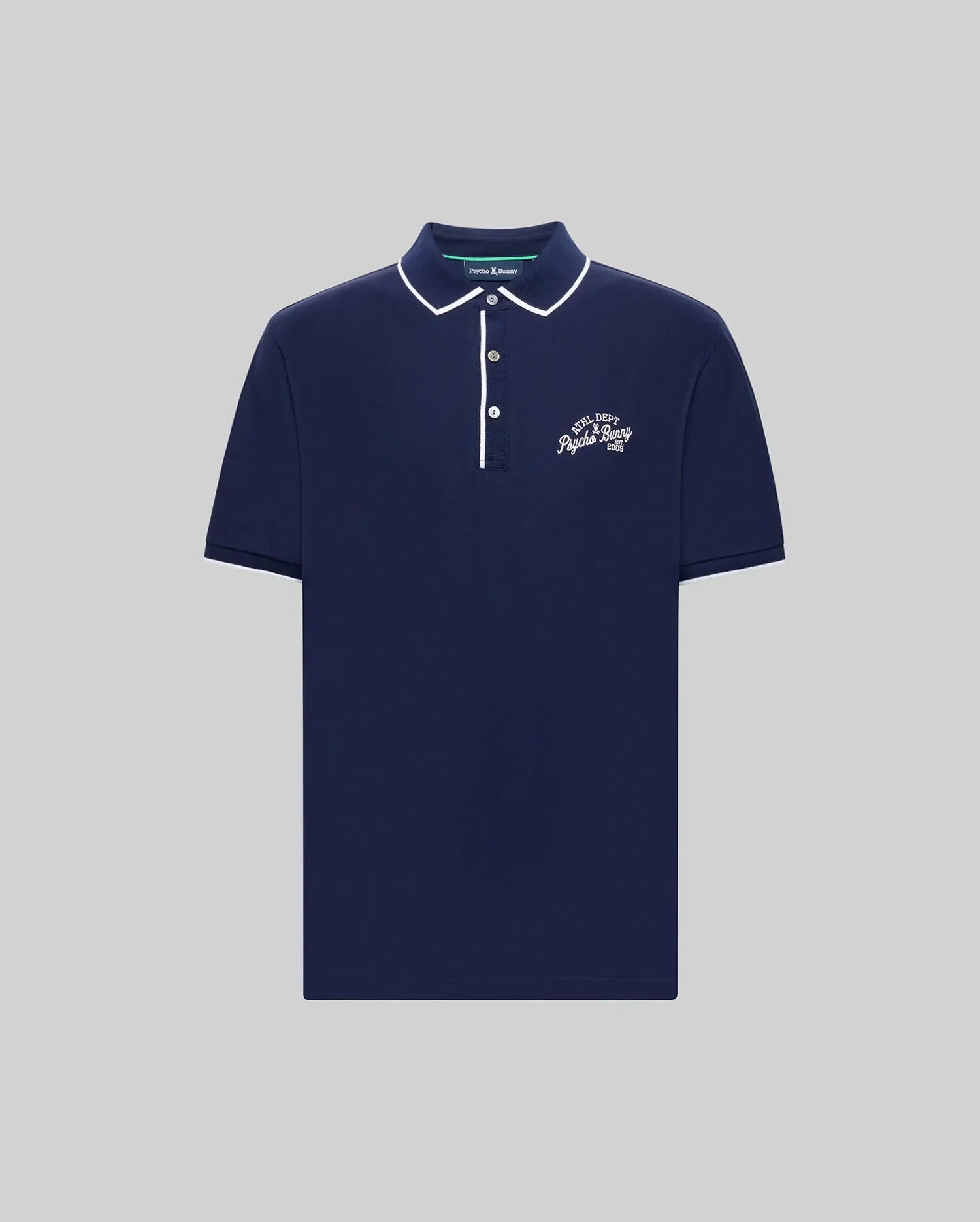 The Psycho Bunny MENS MATTEO PIQUE POLO (MT0100024) is a navy Pima cotton shirt with white collar and placket trim, short sleeves, Mother-of-Pearl buttons, a small white chest logo, classic fit, shown on a plain grey background.