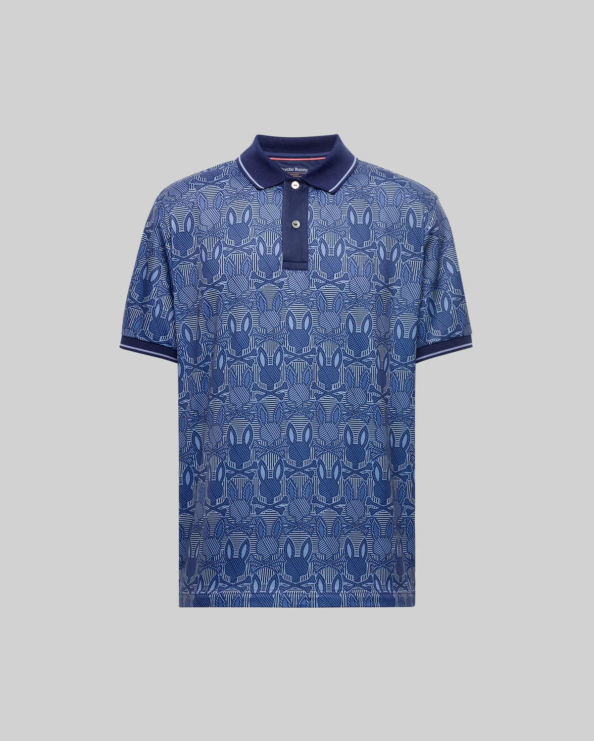 The Psycho Bunny MENS REEVES ALL OVER BUNNY SPORT POLO (MT0100053) features a geometric dark blue bunny print, short sleeves, and dark blue collar and cuffs. Breathable fabric ensures all-day comfort. Shown on a light gray background.