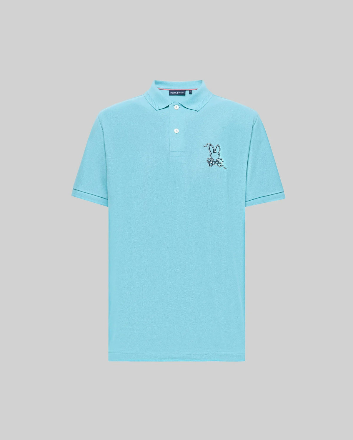 The Psycho Bunny MENS CYRUS PIQUE POLO - MT0100056 features light blue Pima cotton, short sleeves, a collar with two buttons, and an embroidered cartoon rabbit holding a bone on the left chest.