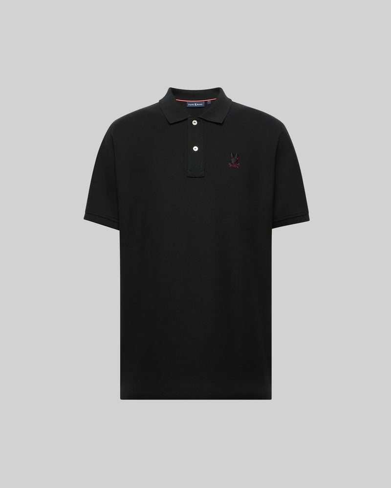 The Psycho Bunny MENS CASSIAN PIQUE POLO - MT0100098 is a black short-sleeve Pima cotton shirt with a collar, two white buttons, and a small embroidered logo on the left chest, shown on a plain gray background.