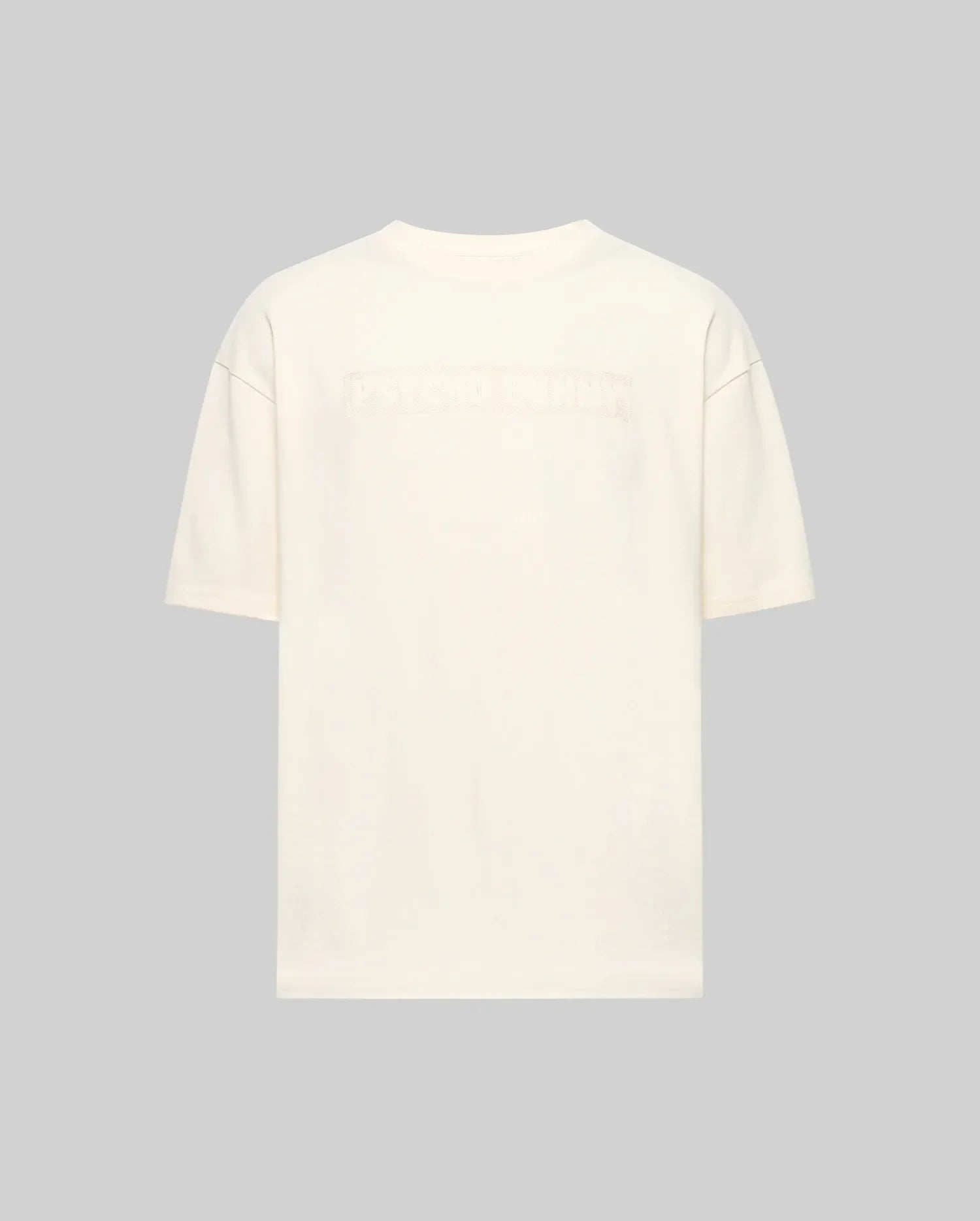Back view of the Psycho Bunny MENS ZAYN OVERSIZED GRAPHIC TEE (MT0200004) in off-white, relaxed fit and heavyweight jersey, featuring subtle embossed text across the upper back against a light gray background.
