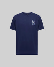The Psycho Bunny MENS DEREK CHEST GRAPHIC TEE (MT0200009) is a navy Pima cotton crewneck with a small white bunny face and bow tie graphic on the left chest, shown against a light gray background.