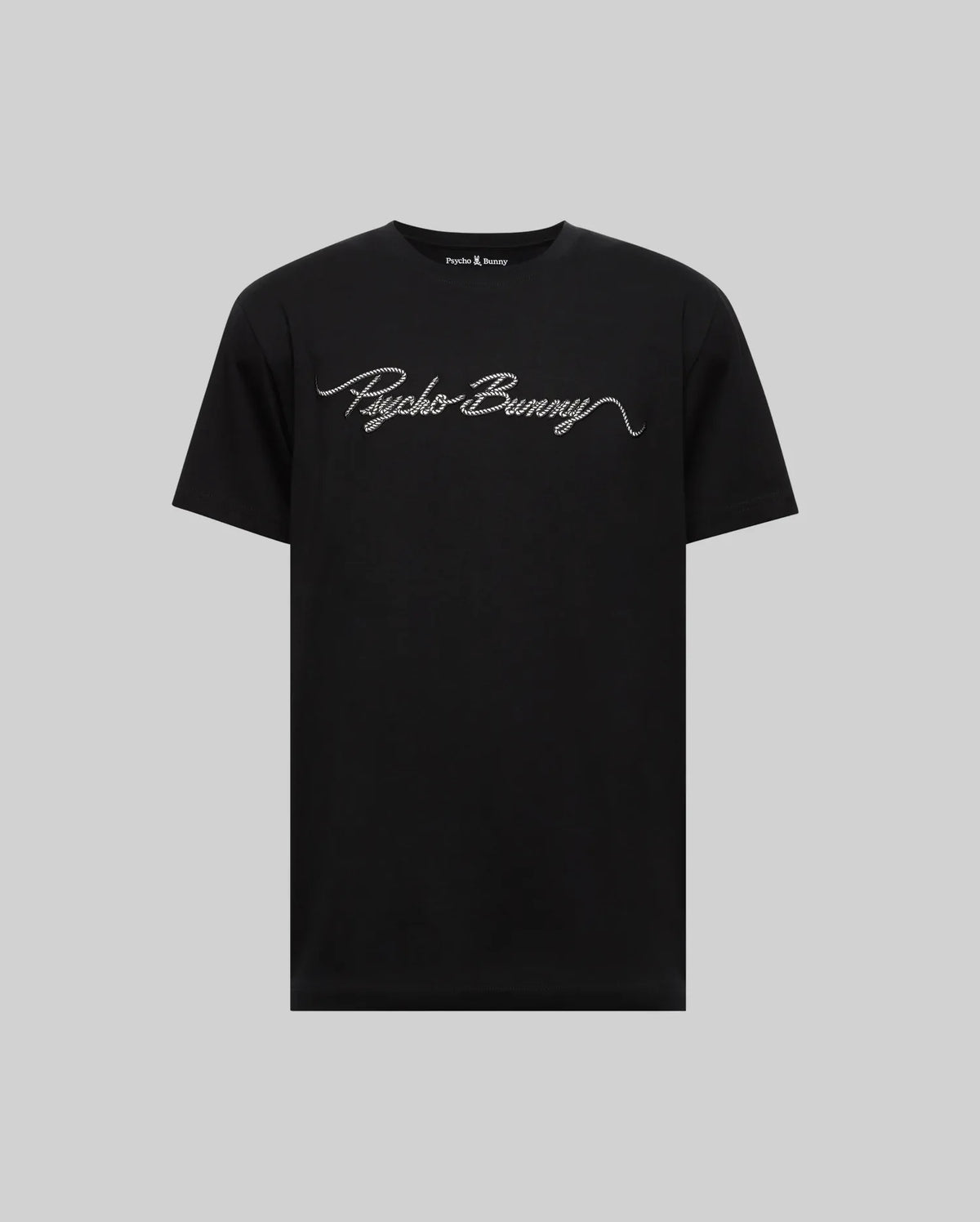 The Psycho Bunny MENS CYRUS WORDMARK GRAPHIC TEE (MT0200018) is a black Pima cotton shirt with "Psycho Bunny" in white cursive on the chest, shown against a plain gray background.
