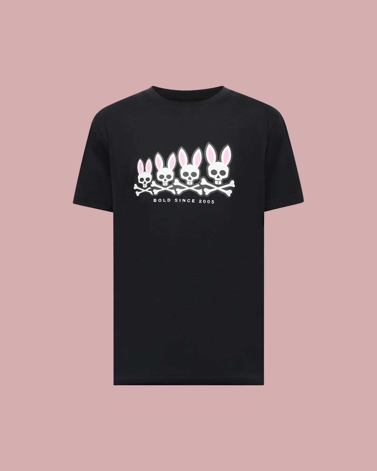The Psycho Bunny MENS ARCHIVE GRADIANT BUNNY GRAPHIC TEE (MT0200029) showcases four iconic white and pink Bunny skull and crossbones with "BOLD SINCE 2005" text, set against a plain light pink background.