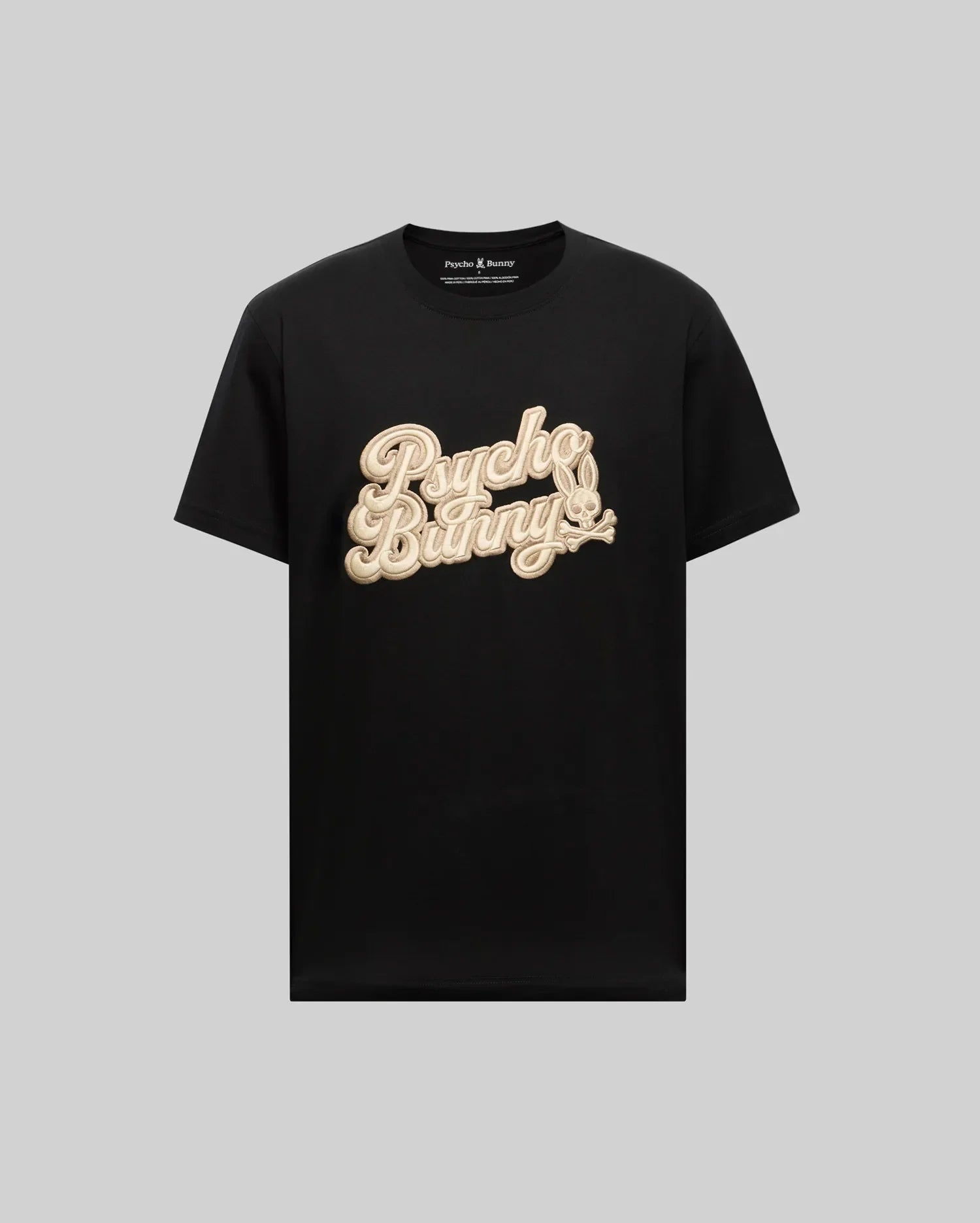 The Psycho Bunny MENS ELIAS GRAPHIC TEE (MT0200047) is a black retro-style Pima cotton t-shirt with beige cursive "Psycho Bunny" text and an embroidered bunny logo on the chest, shown on a plain grey background.