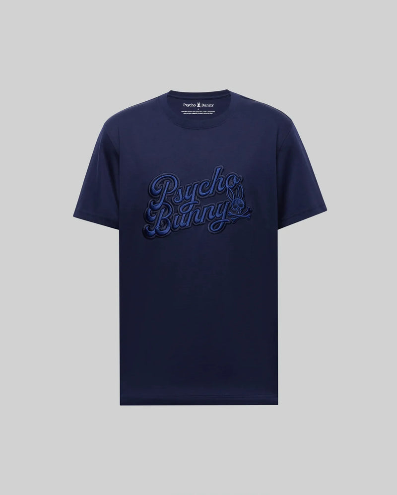 The MENS ELIAS GRAPHIC TEE - MT0200047 by Psycho Bunny is a navy blue Pima cotton short-sleeve shirt, featuring a bold bunny graphic and large "Psycho Bunny" script on the front against a plain light gray background.