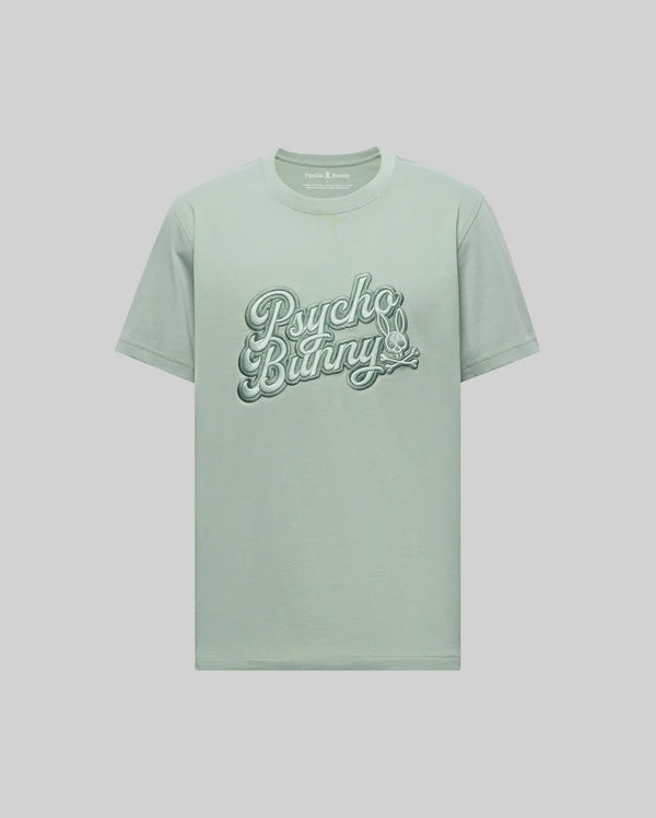 The Psycho Bunny MENS ELIAS GRAPHIC TEE - MT0200047 is a light green Pima cotton shirt with "Psycho Bunny" in bold retro script across the chest and a small crossbones bunny graphic below, shown on a plain background.