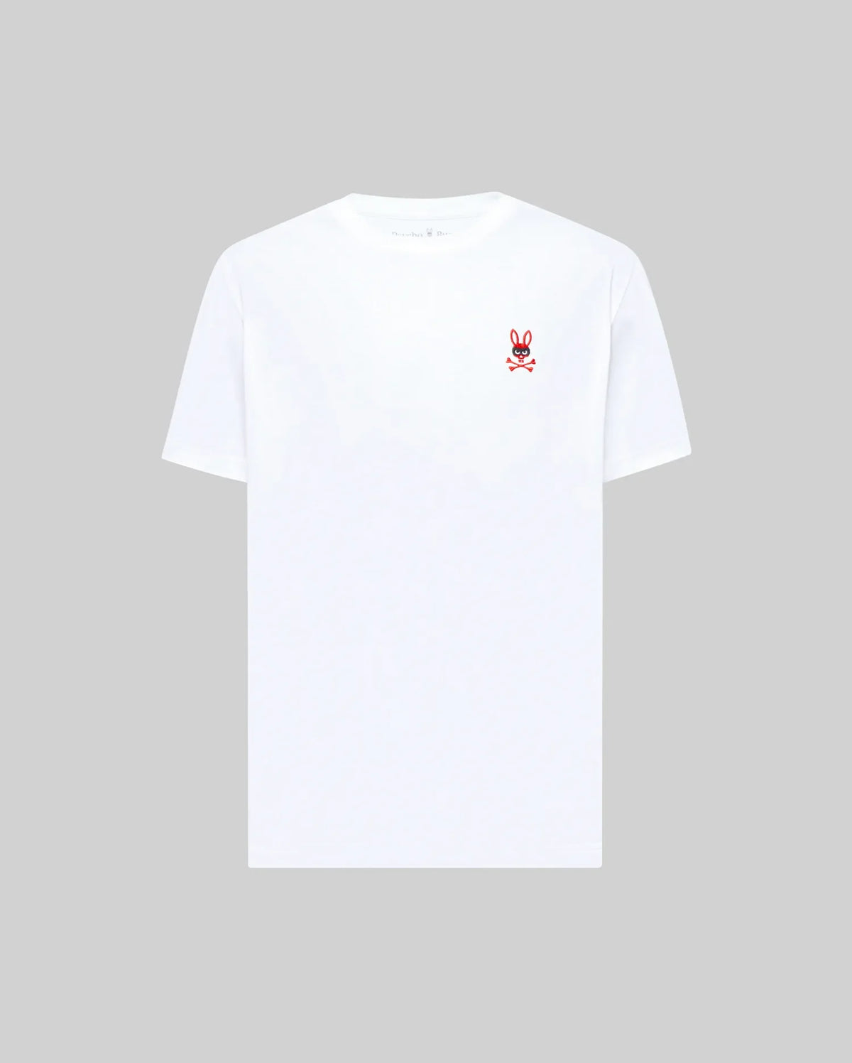 The MENS MISCHIEF BUNNY TEE (MT0200051) by Psycho Bunny is a plain white Pima cotton short-sleeve tee featuring a small embroidered Mischief Bunny and crossbones logo on the left chest, shown on a light gray background.