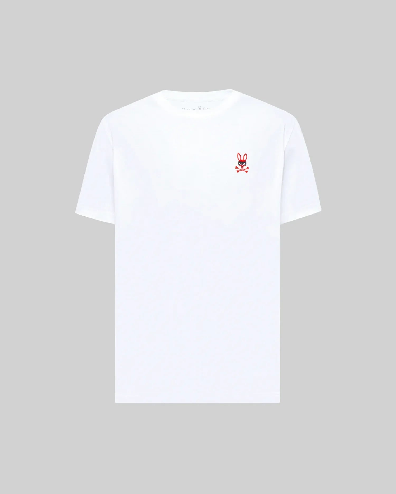 The MENS MISCHIEF BUNNY TEE (MT0200051) by Psycho Bunny is a plain white Pima cotton short-sleeve tee featuring a small embroidered Mischief Bunny and crossbones logo on the left chest, shown on a light gray background.