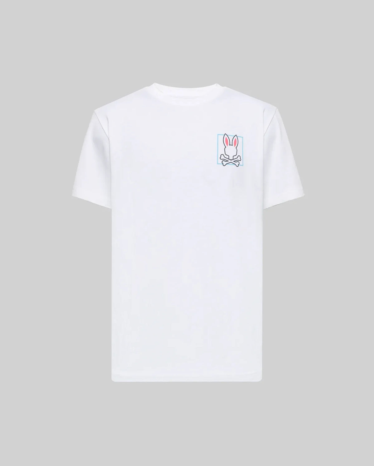 The Psycho Bunny MENS JESSE GRAPHIC TEE (MT0200056) is a plain white Pima cotton shirt with an eco-friendly, water-based pink and white bunny graphic above crossed bones on the left chest, set against a light grey background.