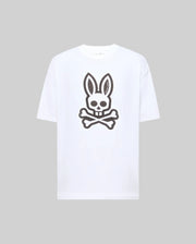 The Psycho Bunny MENS RYDER OVERSIZED FIT TEE (MT0200062) is a premium white Pima cotton T-shirt with an oversized fit, featuring a large black bunny skull and crossbones graphic on the front.