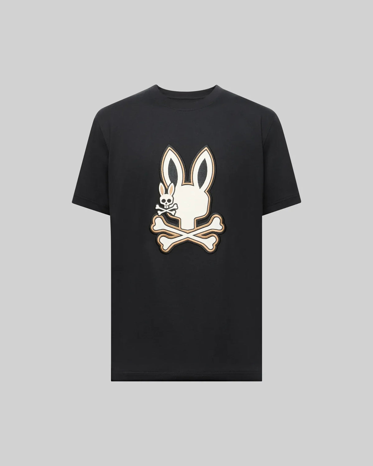 The Psycho Bunny MENS WADE GRAPHIC TEE (MT0200106) is a black 100% cotton shirt featuring a large white bunny head with crossbones on the front, shown against a plain gray background.