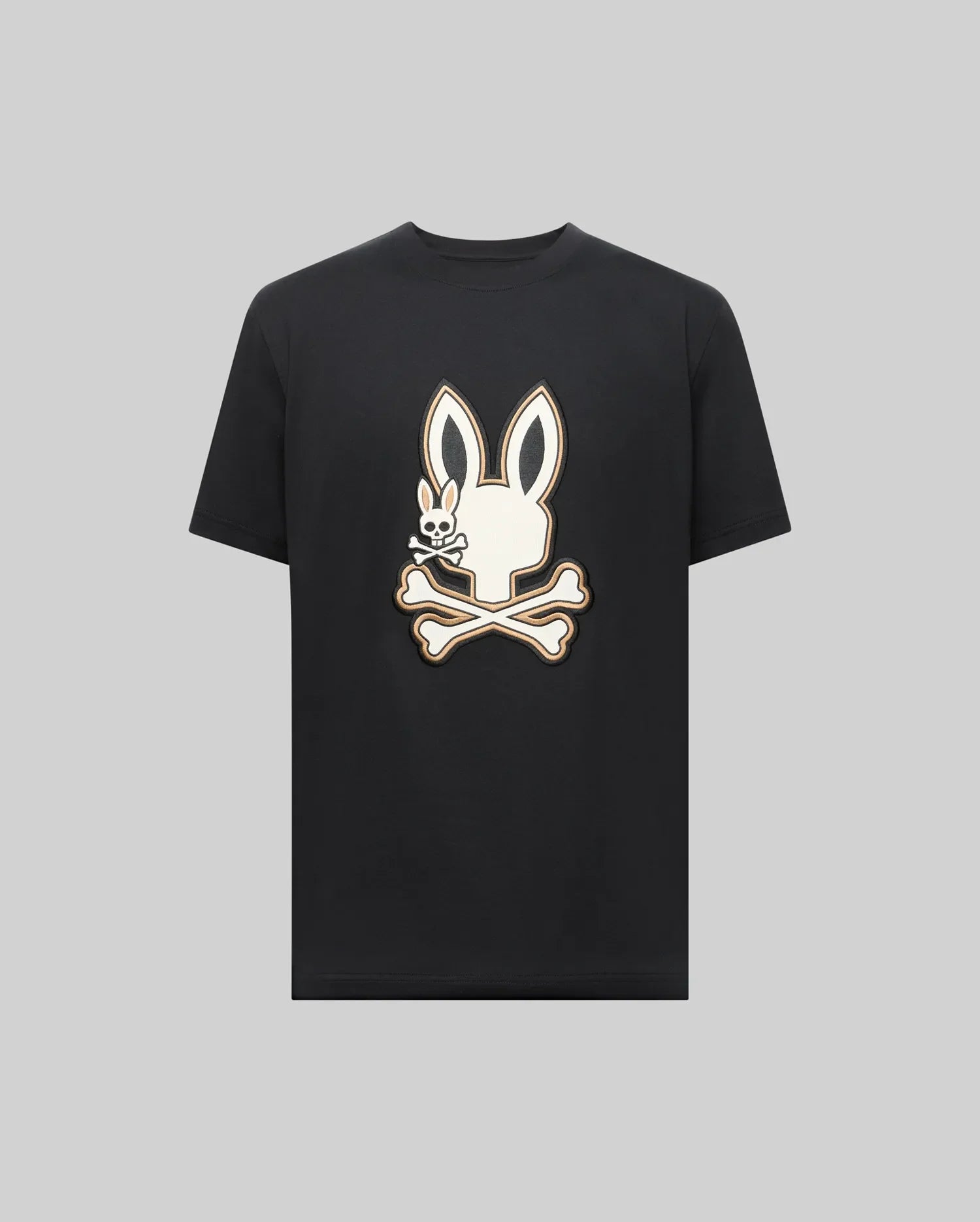 The Psycho Bunny MENS WADE GRAPHIC TEE (MT0200106) is a black 100% cotton shirt featuring a large white bunny head with crossbones on the front, shown against a plain gray background.