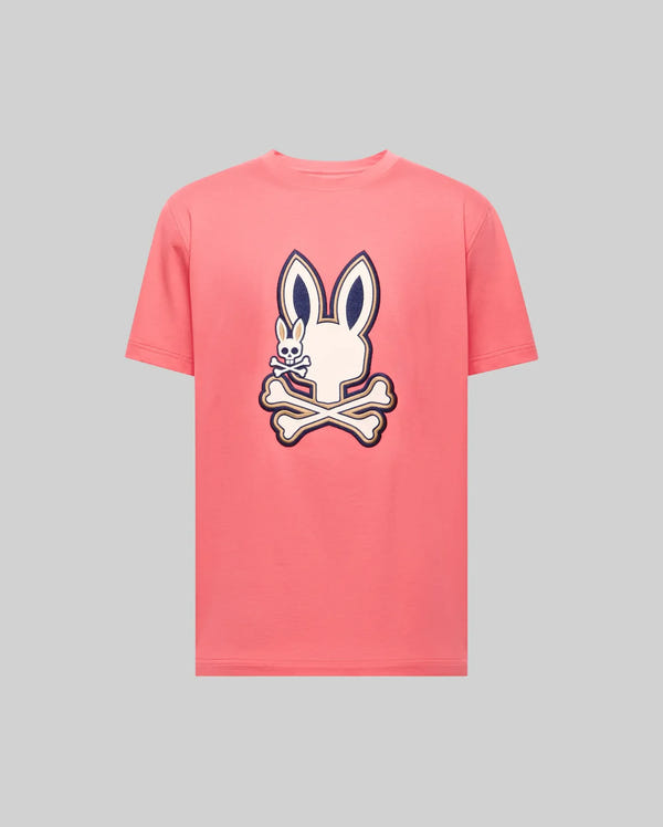 The Psycho Bunny MENS WADE GRAPHIC TEE - MT0200106 is a light gray, 100% cotton, short-sleeve shirt with a large embroidered pink bunny head and crossbones, outlined in dark blue and centered on the chest.