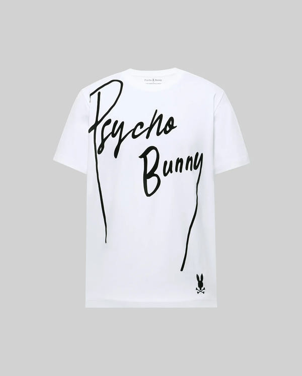 The MENS SOREN GRAPHIC TEE - MT0200180 by Psycho Bunny is a white 100% cotton tee with "Psycho Bunny" in bold, flocked diagonal letters and a small bunny logo with crossbones at the bottom right, set against a light gray background.