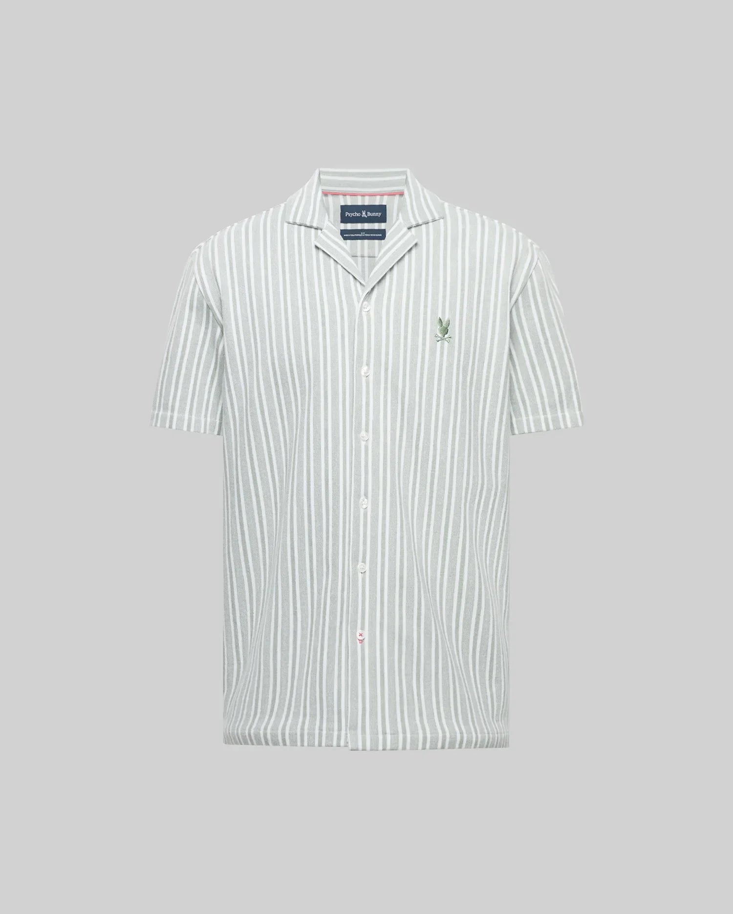 The Psycho Bunny MENS ROBERT TEXTURE STRIPE SHIRT (MT0300005) features short sleeves, a cabana collar, vertical white and light gray stripes, and a small green logo embroidered on the left chest, shown on a plain gray background.