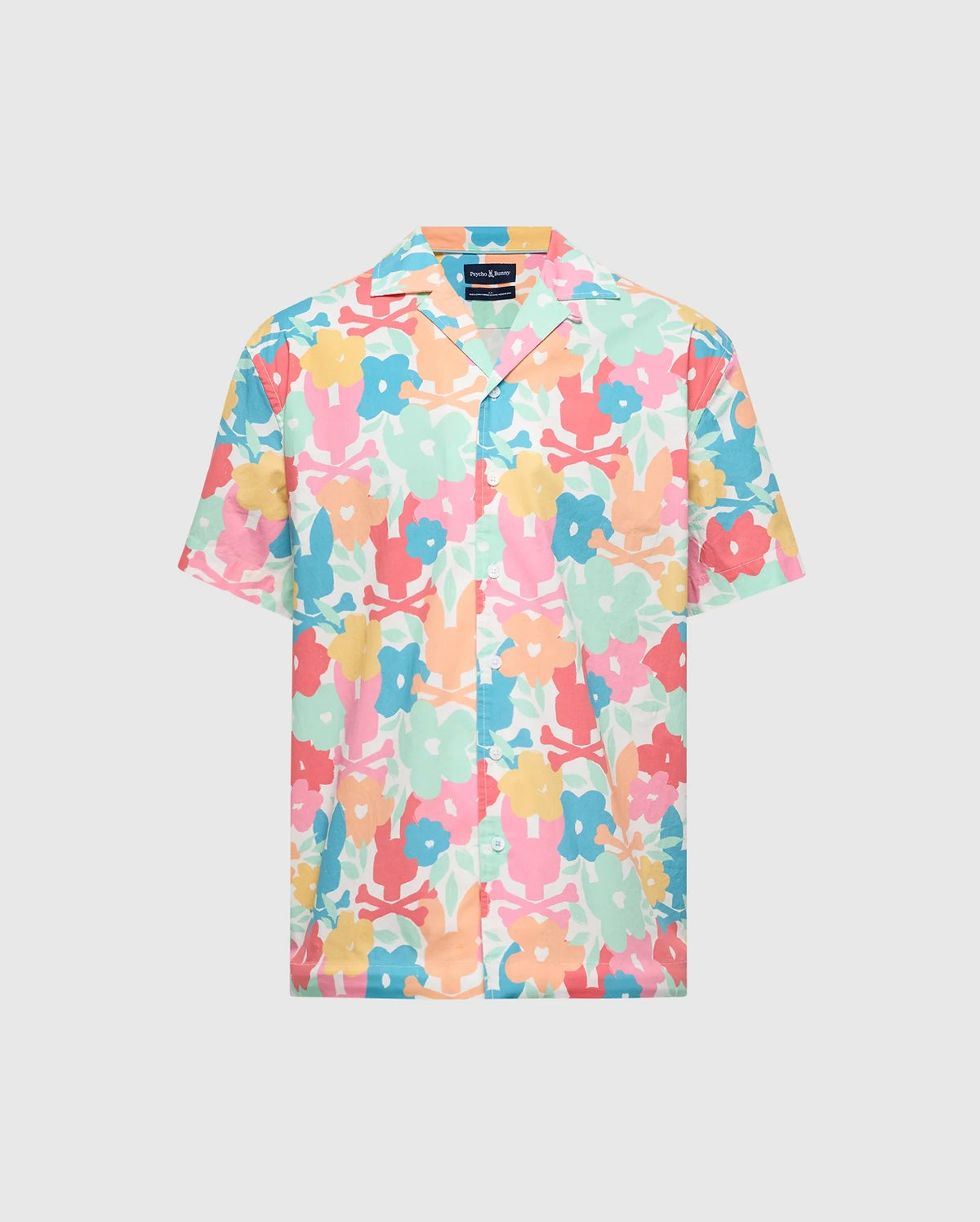 The Psycho Bunny MENS MEYLON STRETCH POPLIN SHIRT (MT0300034) is a short-sleeved poplin shirt with a camp collar, pastel abstract floral print, and an embroidered logo, shown on a plain light gray background.
