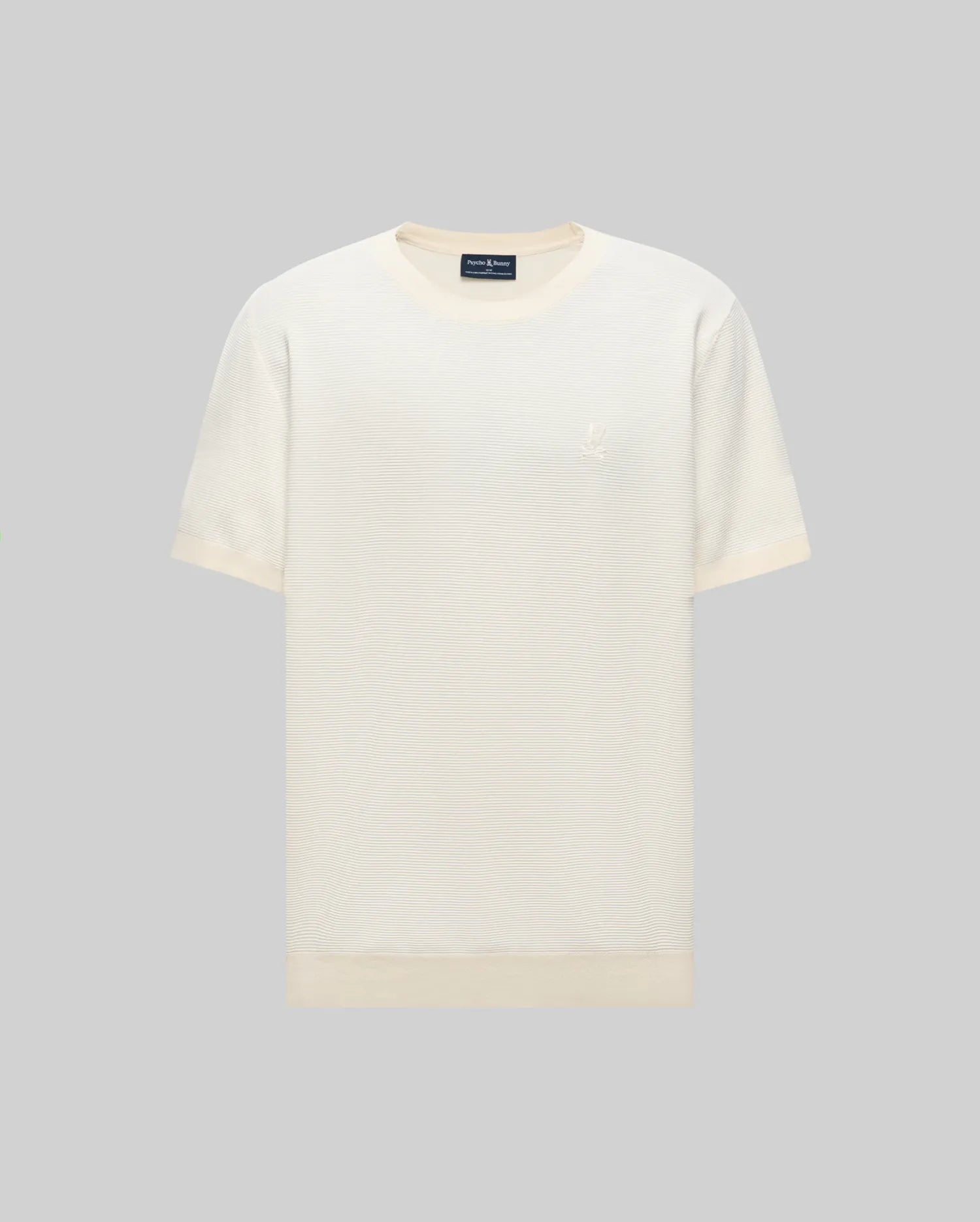 The Psycho Bunny MENS MARIO STRIPED SWEATER T-SHIRT (MT0400009) is a short-sleeved, off-white tee with a round neckline and a subtle embroidered logo on the left chest, displayed against a light gray background. Retro striped pattern adds style.