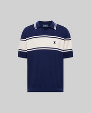 The Psycho Bunny MENS ZAVIAN STRIPE KNIT POLO (MT0400055) features navy blue cotton fabric, white horizontal chest and sleeve stripes, a collar, and a small embroidered logo on the left chest, shown on a plain gray background.