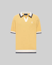 The Psycho Bunny MENS CARTER JOHNNY COLLAR KNIT POLO (MT0400093) is a yellow short-sleeve 100% cotton shirt with a white and navy Johnny collar, chest logo embroidery, and matching sleeve and hem trim, shown on a gray background.