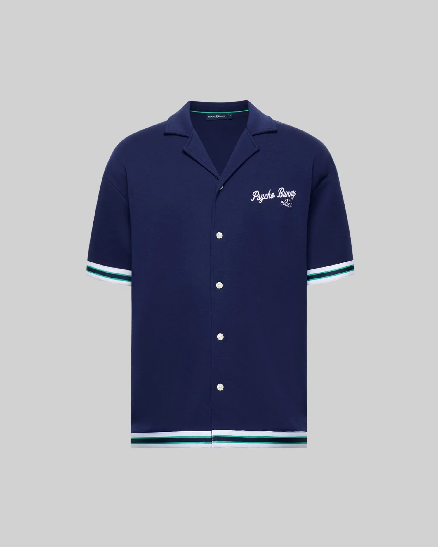 The Psycho Bunny MENS BASIL TAPED CAMP COLLAR SHIRT - MT0500004 is a navy short-sleeve cotton-modal shirt with white/green striped trim, Johnny collar, white buttons, and "Psychic Bunny 2022" embroidered on the chest.