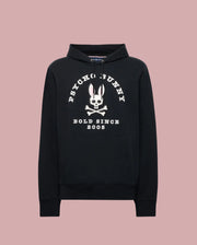 The Psycho Bunny MENS ARCHIVE HOODIE - MT0500009 is a black French terry hoodie with a large white bunny skull and crossbones graphic, “PSYCHO BUNNY” above and “BOLD SINCE 2005” below, plus front pocket and drawstring hood.