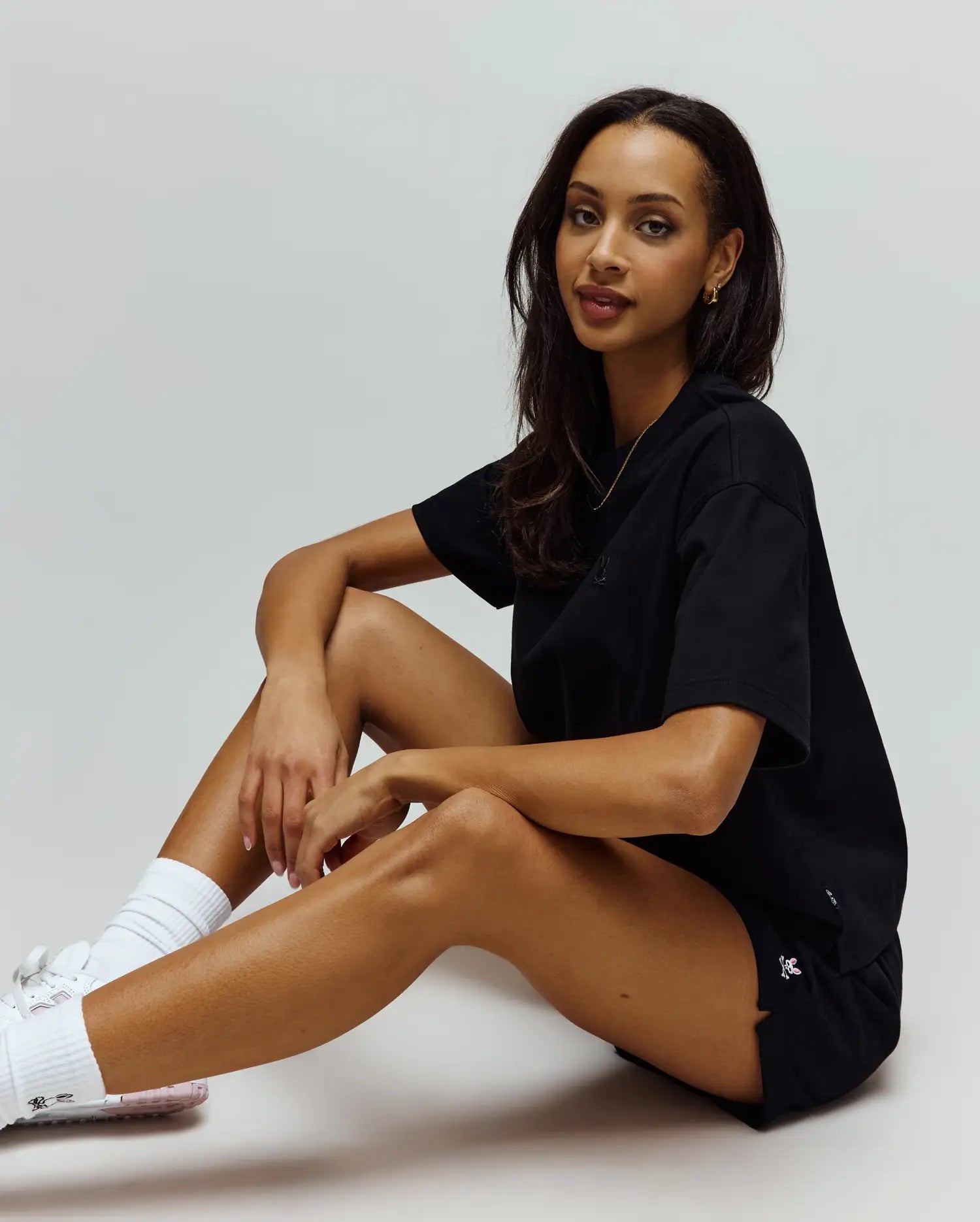 Black relaxed fit jersey t-shirt with a black embroidered bunny skull on the chest, and black Womens Olivia Fleece Short featuring a white/pink embroidered bunny skull on the left hem.