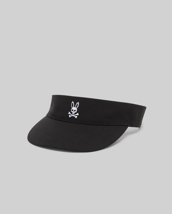 The WOMEN'S SPORT VISOR - WO1500001 by Psycho Bunny is a black cap with a white embroidered bunny head and crossed bones on the front, shown against a plain light gray background.