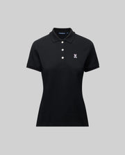 The Psycho Bunny WOMENS PIQUE POLO - WT0100003 is a black short-sleeve women’s polo with a collar, three white buttons, and a 4k-stitch embroidered Bunny logo on the left chest, shown on a plain gray background.
