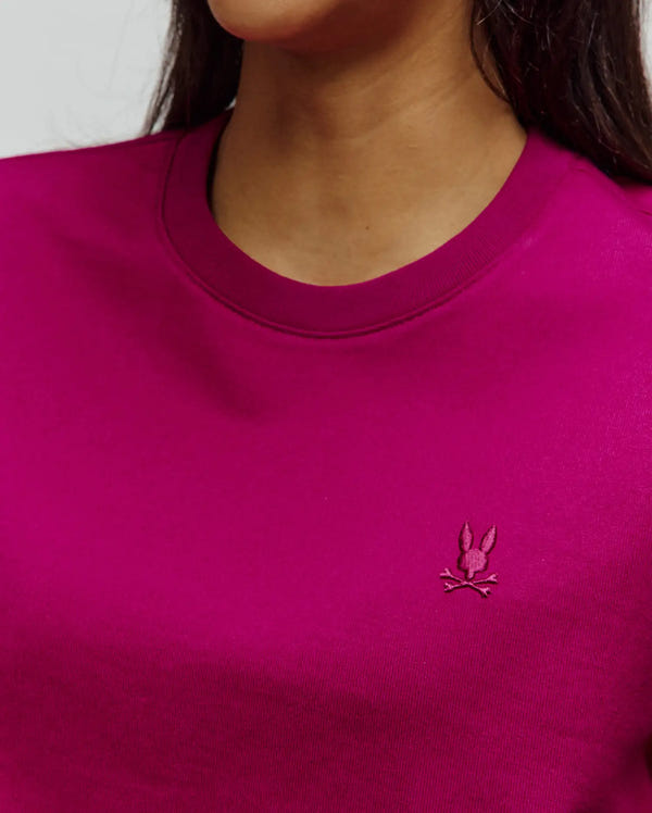 Women's Camille Oversized Fit Tee in vibrant magenta, featuring a smooth jersey knit fabric and a small, tonal embroidered Psycho Bunny skull logo on the left chest.