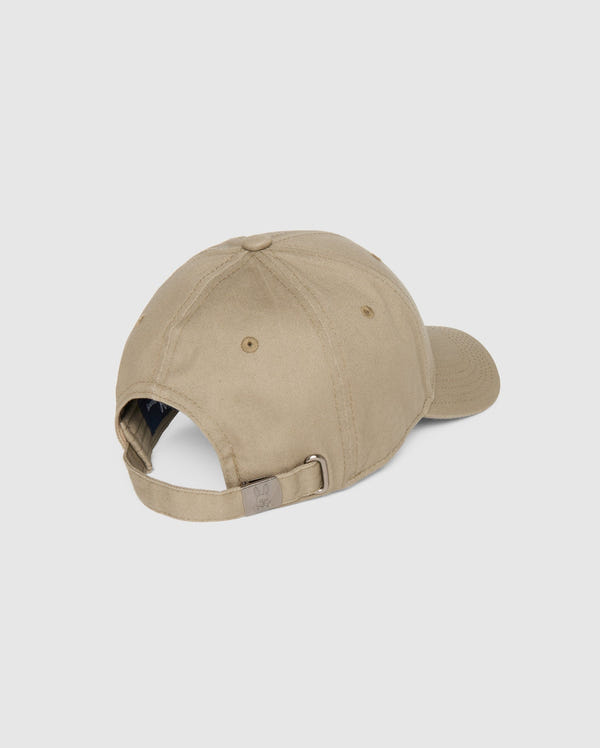 The Psycho Bunny MENS CLASSIC BASEBALL CAP - B6A816A1HT is shown from the back, highlighting its adjustable fit with a metal buckle strap. Crafted in khaki cotton twill, it features a curved brim and six-panel construction against a plain white backdrop.