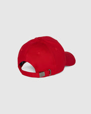 The Psycho Bunny MENS CLASSIC BASEBALL CAP - B6A816A1HT is red with a curved brim, made of six-panel cotton twill, adjustable via a metal buckle strap, and showcases an embroidered Bunny logo. It's shown from the back against a plain gray backdrop.